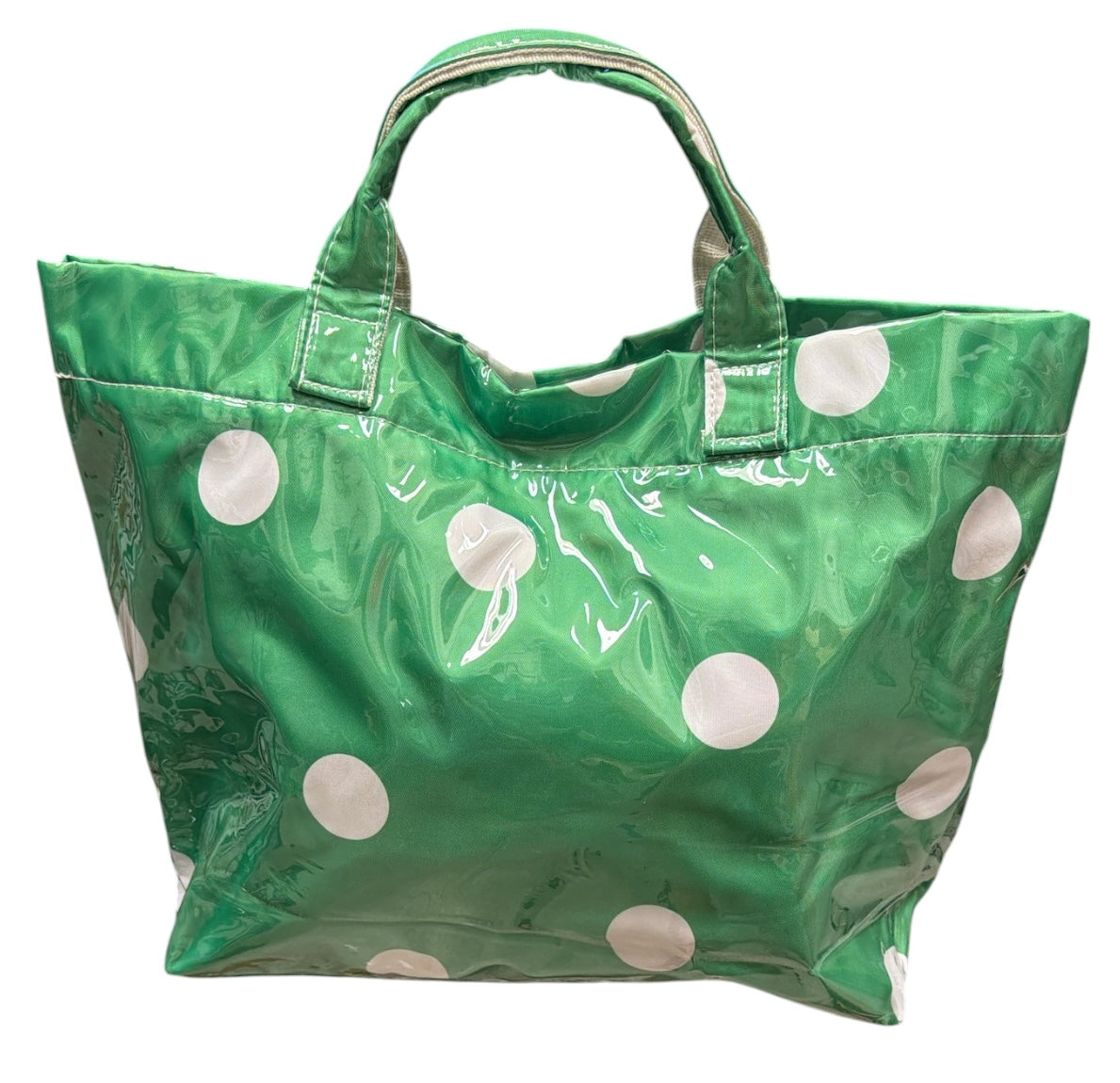 Green polka dot tote bag with shiny finish and white dots.