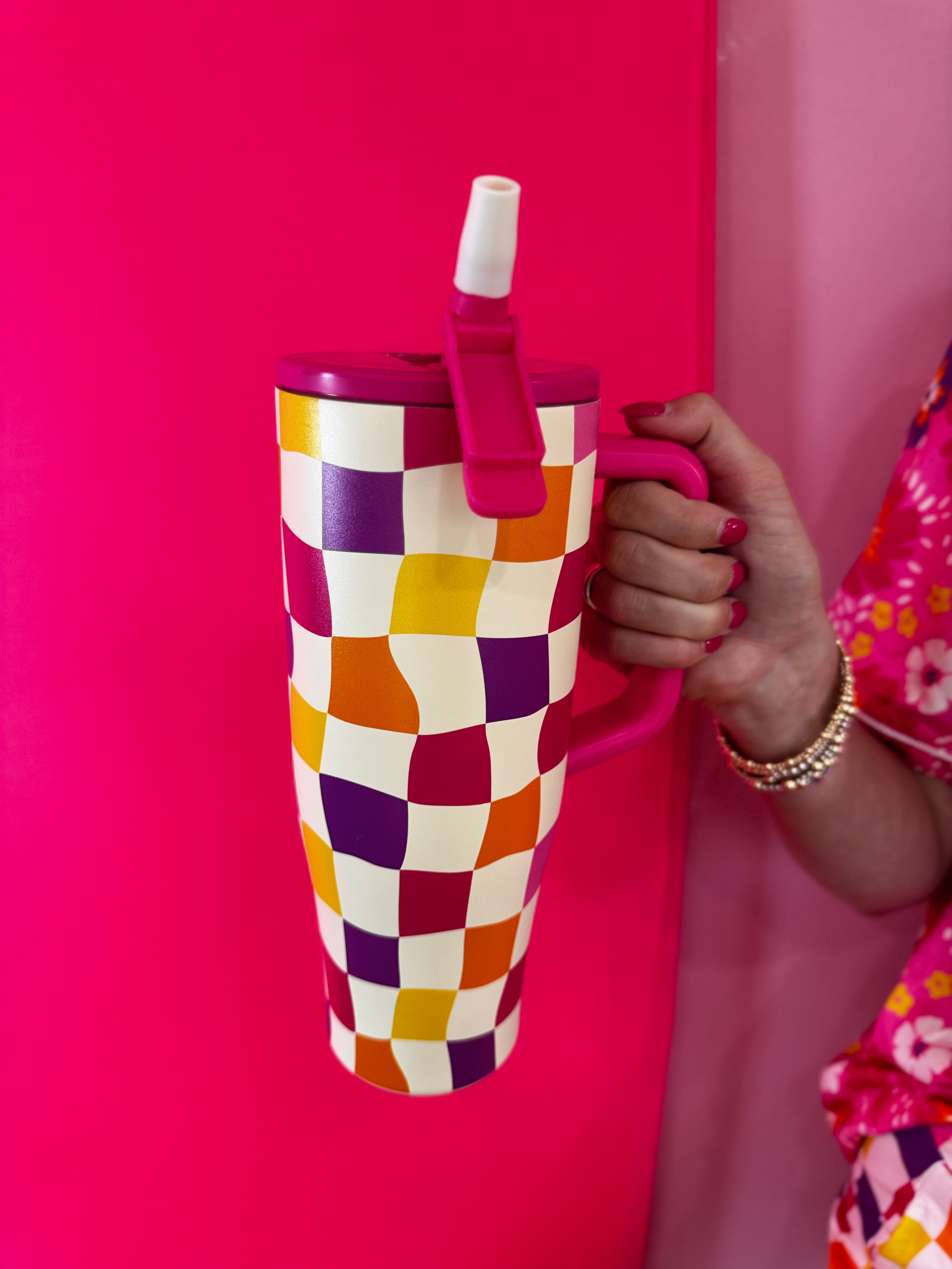 40oz colorful checkered tumbler with flip straw lid and handle.