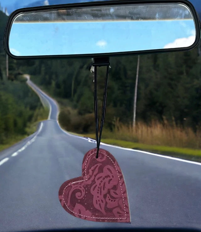 Heart-shaped leather and cowhide car freshener charm, handcrafted, reusable with scented oil mists, ideal for car, home, or camper.