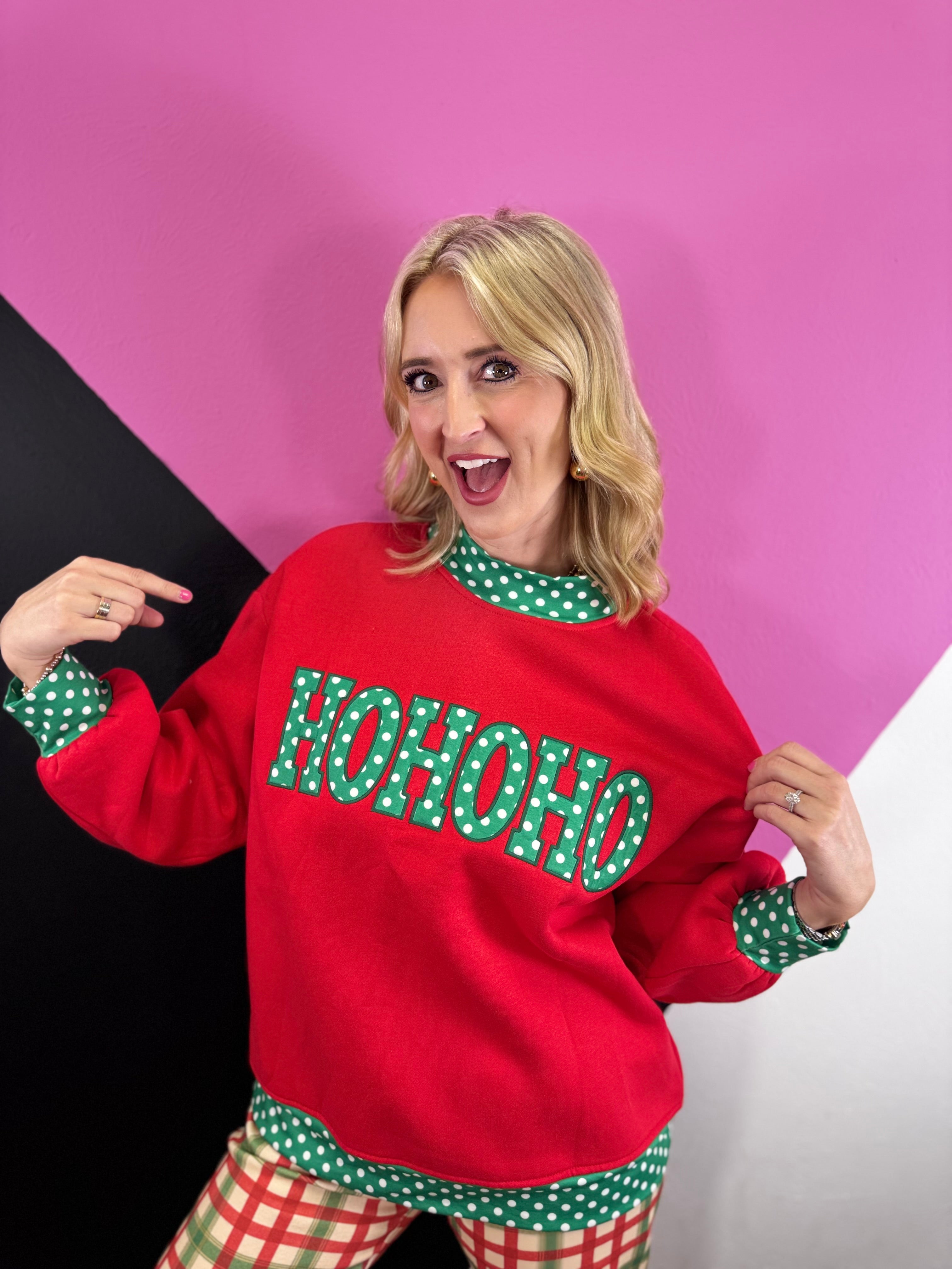 Red Christmas sweatshirt with green HO HO HO letters and white polka dot trim