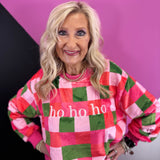 Fuzzy HO HO HO sweatshirt with pink, red, and green checkered holiday print.