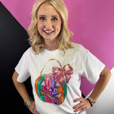 White Halloween top with colorful sequin jack-o'-lantern and oversized hot pink sequin bow.