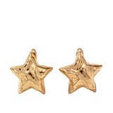 Hammered gold star earrings with lightweight design and textured shine.