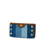 Hammitt 110 North wallet with mixed denim, mahogany leather trim, and antique gold hardware.
