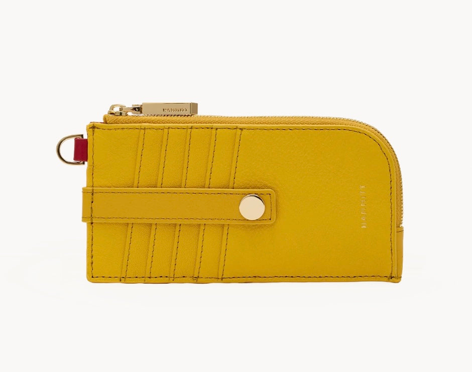 Hammitt 210 East wallet in two-tone yellow pebbled leather with shiny gold hardware.