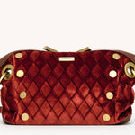 Small Hammitt Daniel crossbody clutch in cherrywood leather with orange Italian velvet accents and brushed gold hardware.