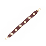 Hammitt cherrywood oxblood red pebbled leather handbag strap with brushed gold grommet detailing.