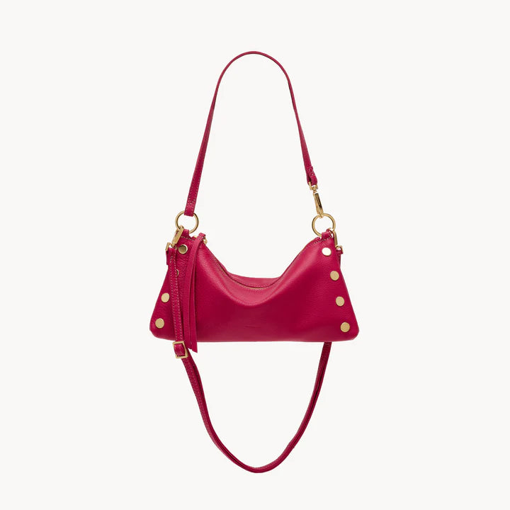 Fuchsia pebbled leather Consuela Kyle bag with gold hardware and convertible straps.