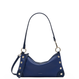 Hammitt Kyle denim blue leather handbag with navy panels, silver hardware, and adjustable strap.