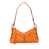 Orange leather convertible handbag with brown strap and silver hardware