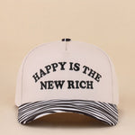 Two-tone snapback hat with Happy Is The New Rich embroidery and zebra print detail.