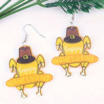 Thanksgiving turkey earrings made of acrylic in fall colors with laser-cut detail and festive charm.