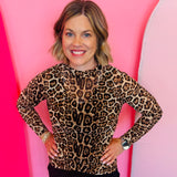 Sheer leopard mesh top with kitty print, long sleeves, and stretchy fabric for bold layered styling.
