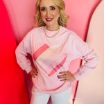 Light pink heart patchwork oversized sweatshirt with mock neck and cozy fleece fabric.