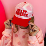 Heart Breaker hat with red lettering and pink striped detail, adjustable snapback canvas cap