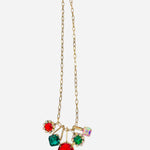 Gold or silver chain necklace with oversized red, emerald, and iridescent gem clusters.