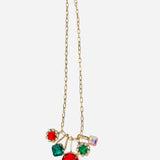 Gold or silver chain necklace with oversized red, emerald, and iridescent gem clusters.