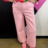 Hot pink and white striped high-rise wide leg pants with five-pocket styling.