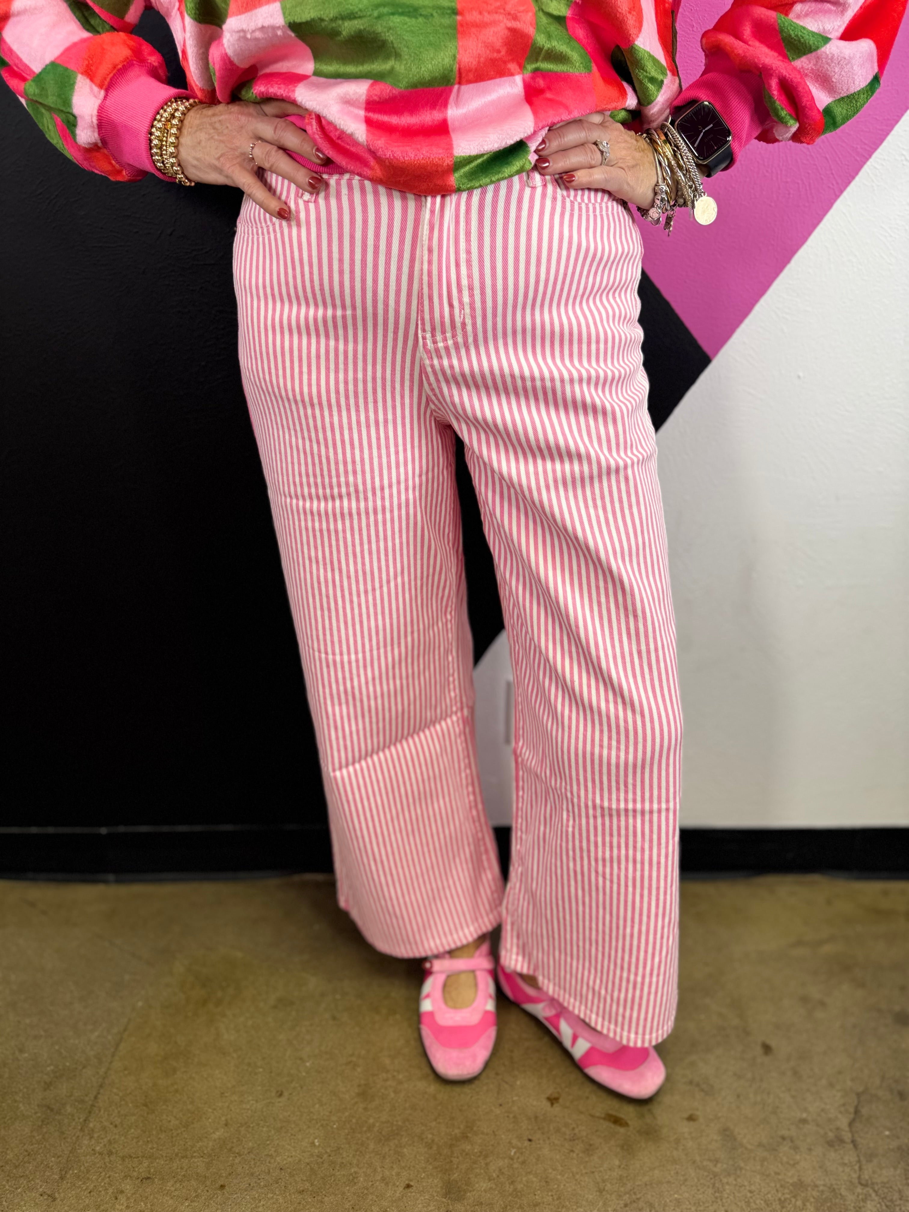 Hot pink and white striped high-rise wide leg pants with five-pocket styling.