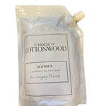Dunes all-natural laundry detergent 32oz bag, plant-based and chemical-free for fresh, clean clothes.