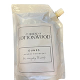 Dunes all-natural laundry detergent 32oz bag, plant-based and chemical-free for fresh, clean clothes.