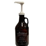 Reusable House of Cottonwood detergent bottle with sleek design for stylish, sustainable laundry room organization.