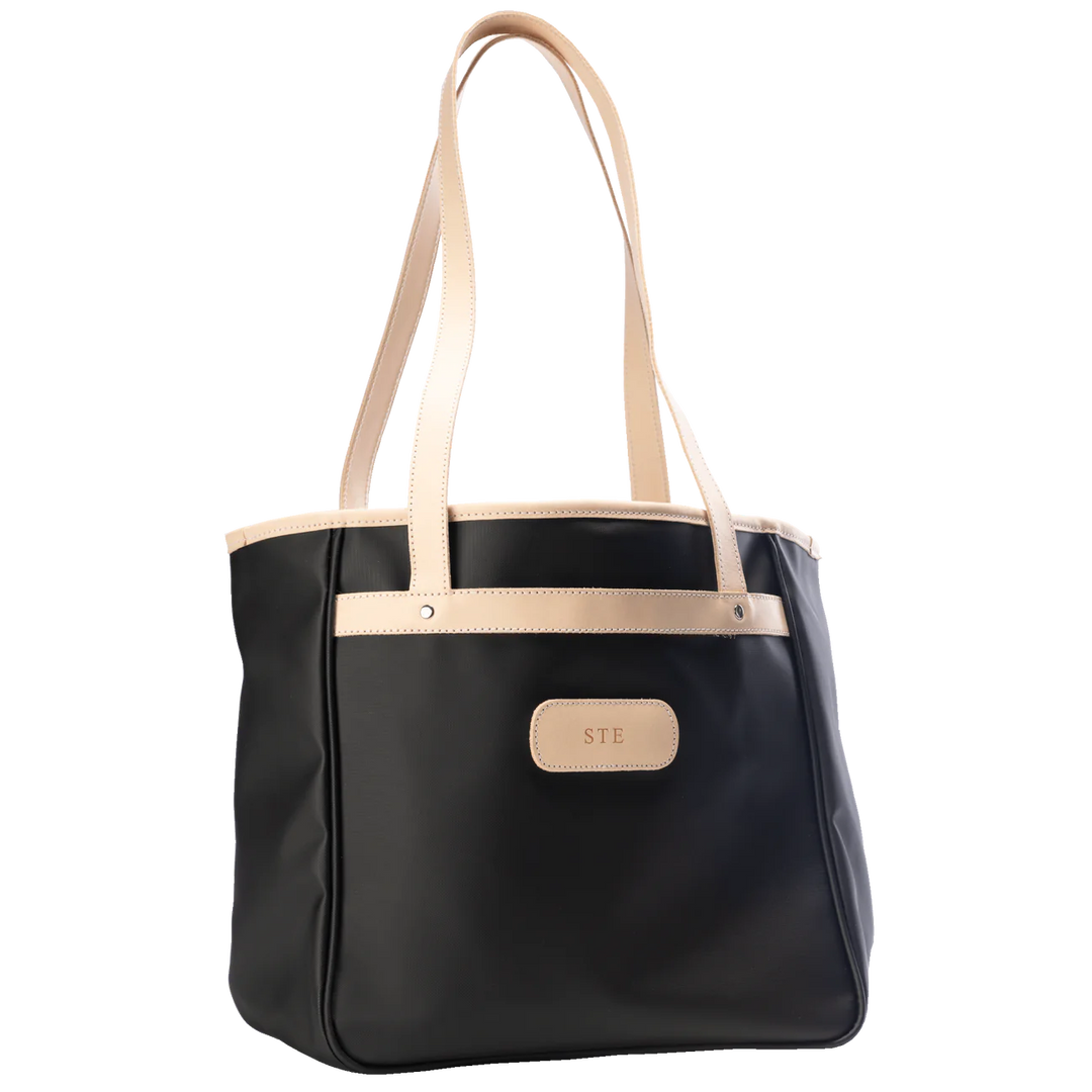 Jon Hart Amelia Tote in black coated canvas with natural leather trim, padded laptop sleeve, trolley sleeve, and spacious interior pockets