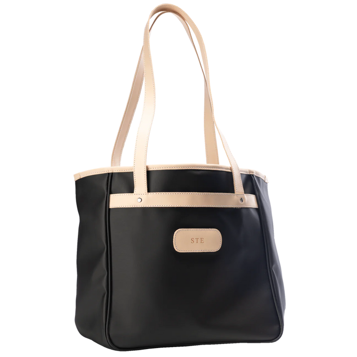 Jon Hart Amelia Tote in black coated canvas with natural leather trim, padded laptop sleeve, trolley sleeve, and spacious interior pockets