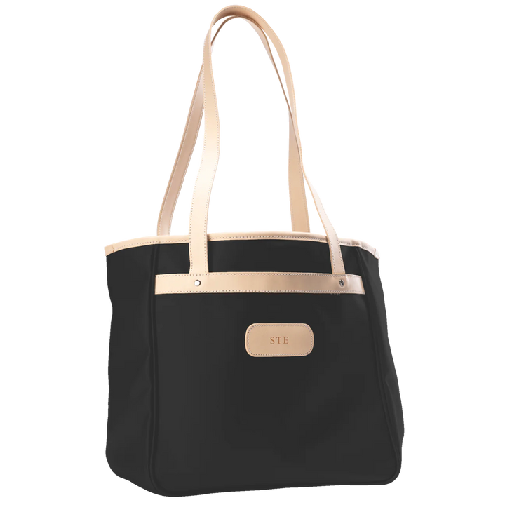 Jon Hart Amelia Tote in black coated canvas with natural leather trim, padded laptop sleeve, trolley sleeve, and spacious interior pockets