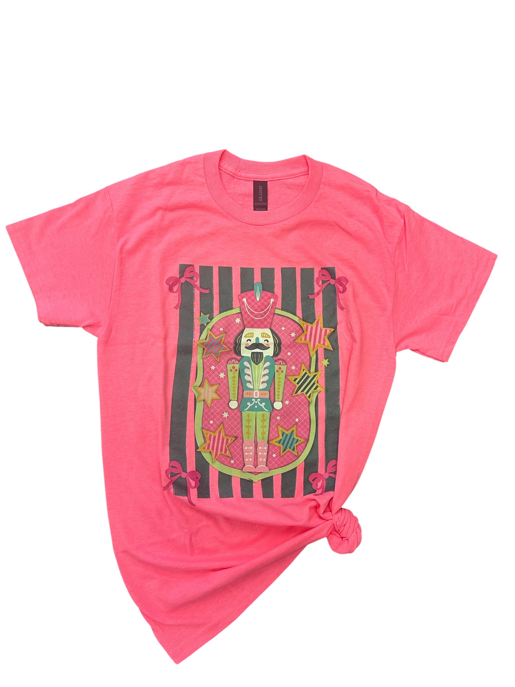 Nutcracker Tee in neon pink with cute nutcracker graphic, unisex fit, and soft 50/50 blend.