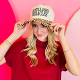 Leopard print cap with “He Still Does Miracles” embroidered on the front.