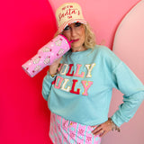 Pink Christmas tumbler with bow-topped holiday treats, hot pink handle, and reusable straw.