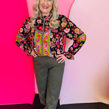 Floral border print top with ruffled neckline, balloon sleeves, and floral trim detail.