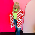 Oversized red and white checkered cardigan with open front, long length, and front pockets.