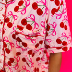 Close-up image highlighting the cherry print design on the pajama top, showing the vibrant red cherries and playful pattern.