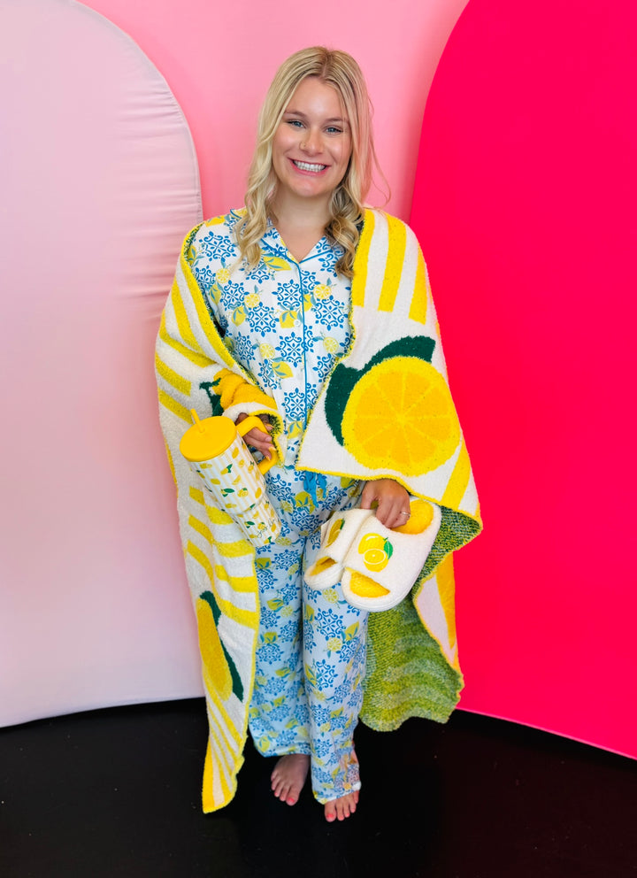 Lounge top paired with matching pajama bottoms, shown alongside coordinating cup, slippers, and blanket in the same design for a complete set.