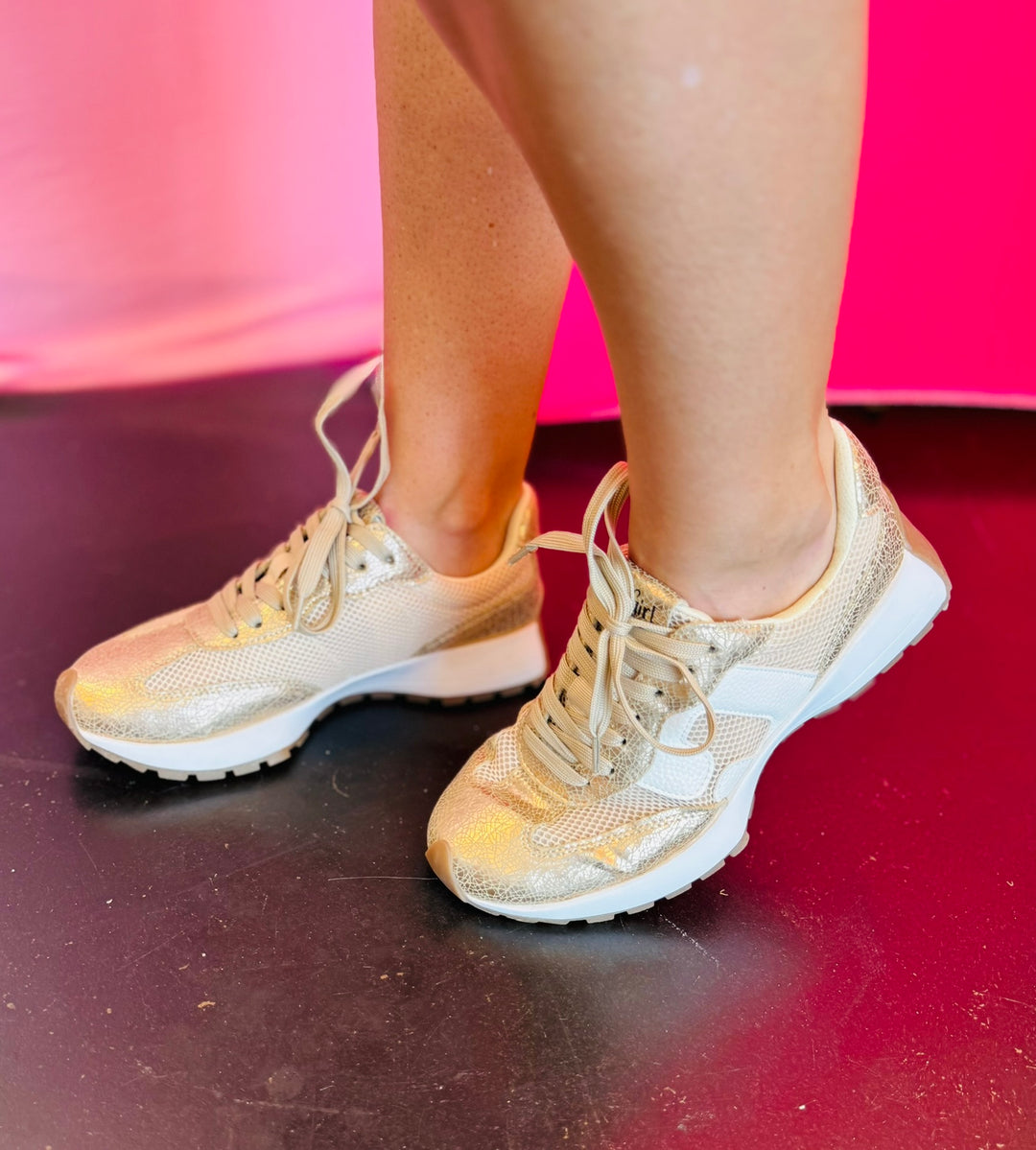 Gold cracked metallic sneakers with leather upper, lace-up front, and cushioned sole