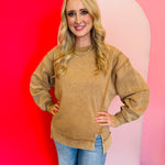 Camel acid wash fleece sweatshirt with exposed seams, relaxed fit, and side slits.