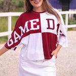 Huddle Up Color Block Top with chenille and sequin patches, bold color-block design, and trendy mom crop fit in soft polyester-rayon-spandex fabric.