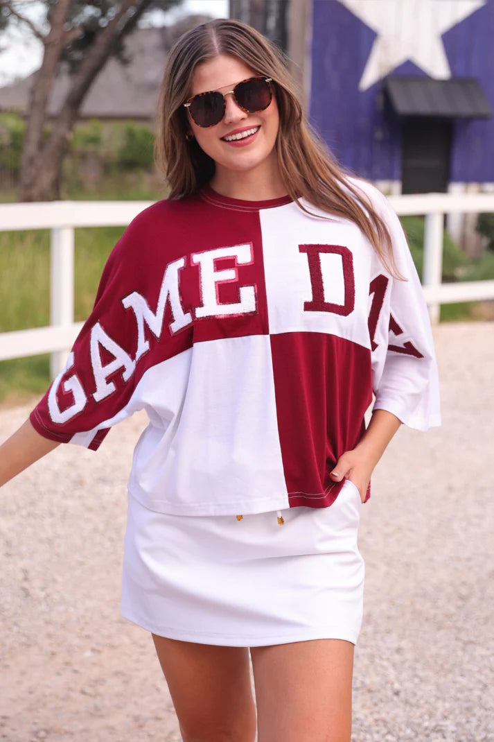 Huddle Up Color Block Top with chenille and sequin patches, bold color-block design, and trendy mom crop fit in soft polyester-rayon-spandex fabric.
