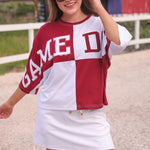 Huddle Up Color Block Top with chenille and sequin patches, bold color-block design, and trendy mom crop fit in soft polyester-rayon-spandex fabric.