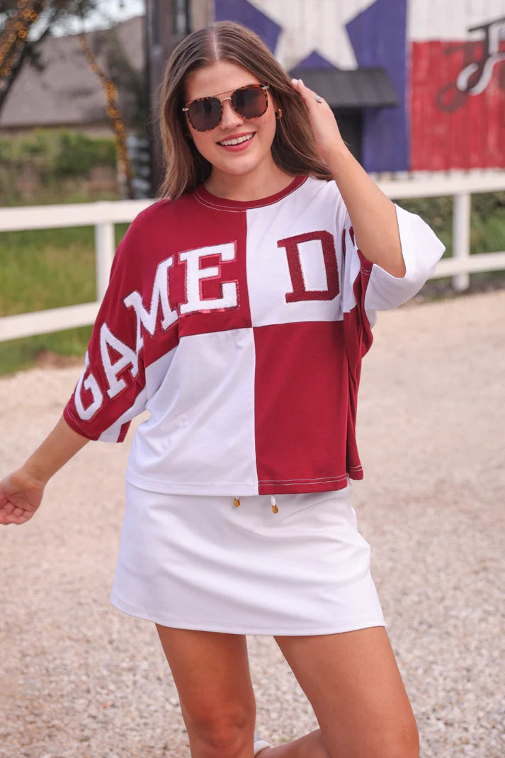 Huddle Up Color Block Top with chenille and sequin patches, bold color-block design, and trendy mom crop fit in soft polyester-rayon-spandex fabric.