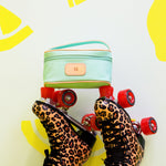 Jon Hart Mini Makeup Bag with coated canvas, leather trim, and zippered closure for stylish travel organization.