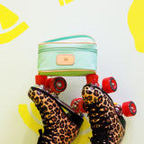 Jon Hart Mini Makeup Bag with coated canvas, leather trim, and zippered closure for stylish travel organization.