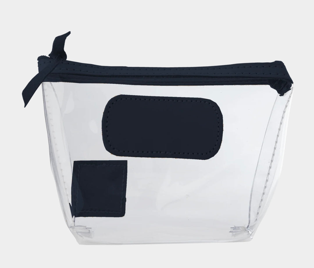 Jon Hart Airport Chico clear TSA-compliant travel pouch with navy Natural Leather trim, flat bottom, and zippered brass closure—perfect for carrying 3oz liquids and travel essentials.