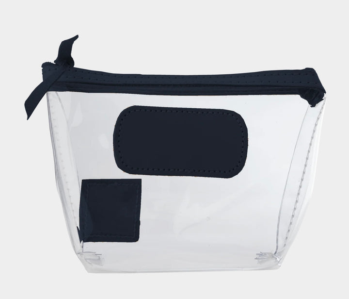 Jon Hart Airport Chico clear TSA-compliant travel pouch with navy Natural Leather trim, flat bottom, and zippered brass closure—perfect for carrying 3oz liquids and travel essentials.
