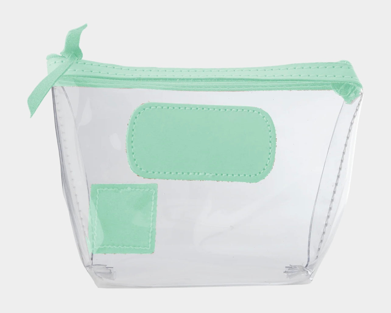 Jon Hart Airport Chico clear TSA-compliant travel pouch with pistachio Natural Leather trim, flat bottom, and zippered brass closure—perfect for carrying 3oz liquids and travel essentials.