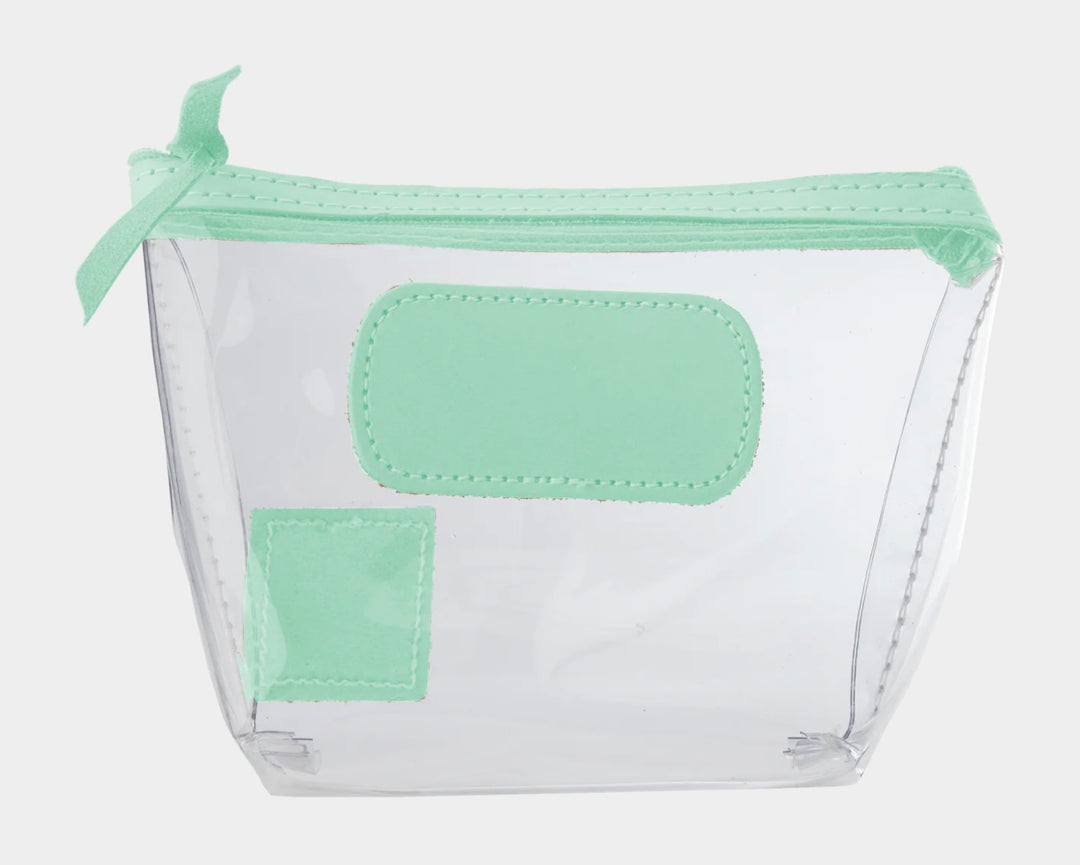 Jon Hart Airport Chico clear TSA-compliant travel pouch with pistachio Natural Leather trim, flat bottom, and zippered brass closure—perfect for carrying 3oz liquids and travel essentials.