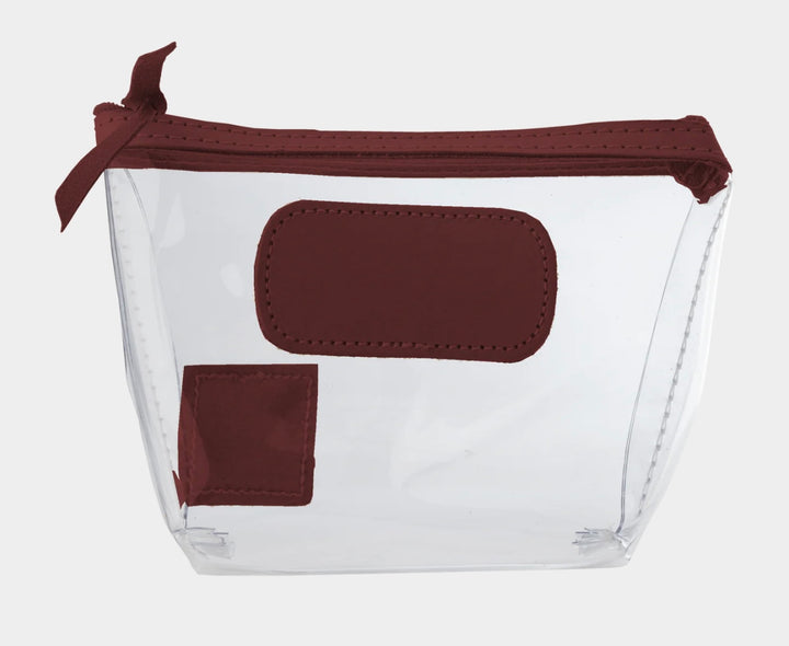 Jon Hart Airport Chico clear TSA-compliant travel pouch with wine Natural Leather trim, flat bottom, and zippered brass closure—perfect for carrying 3oz liquids and travel essentials.
