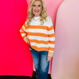 Zenana Orange striped cotton sweater with relaxed boxy fit, crew neckline, and contrast striped cuffs.